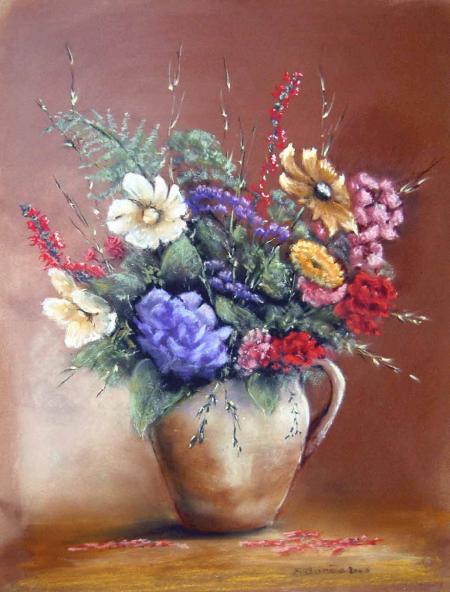 cruche en cailloux et fleurs